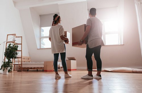 Young couple moving into a new house